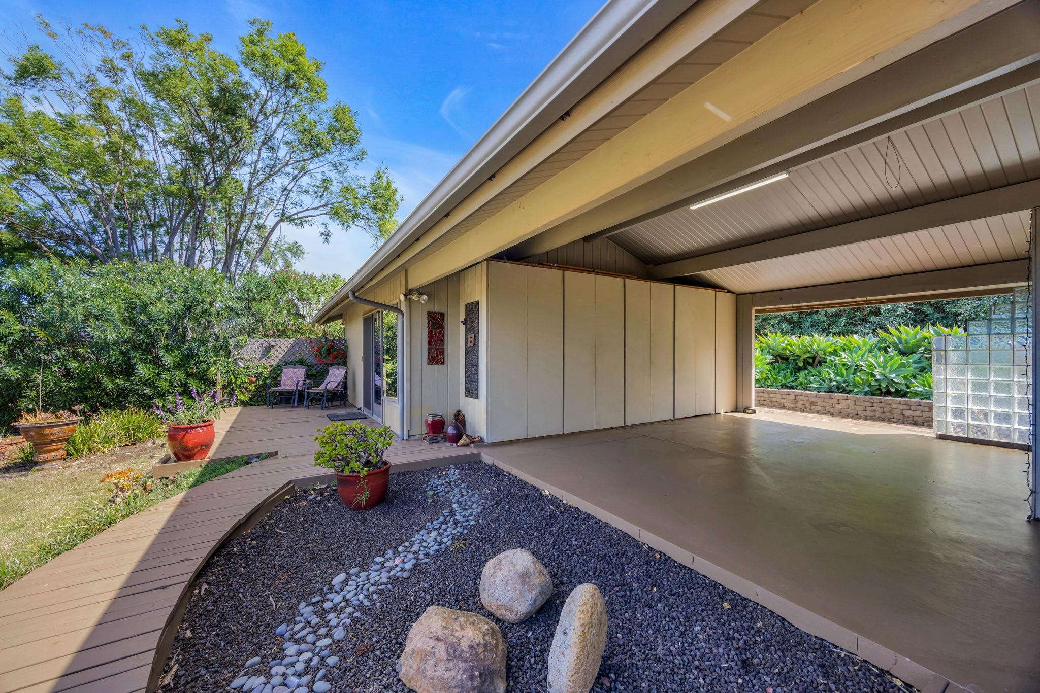 50 Poha Place Makawao, HI 96768 - Photo 42 of 50 a view of a porch with furniture and floor to ceiling window