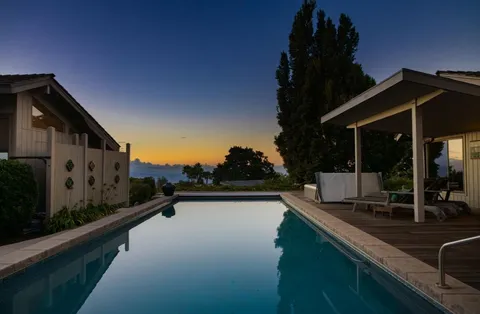 a view of swimming pool with patio