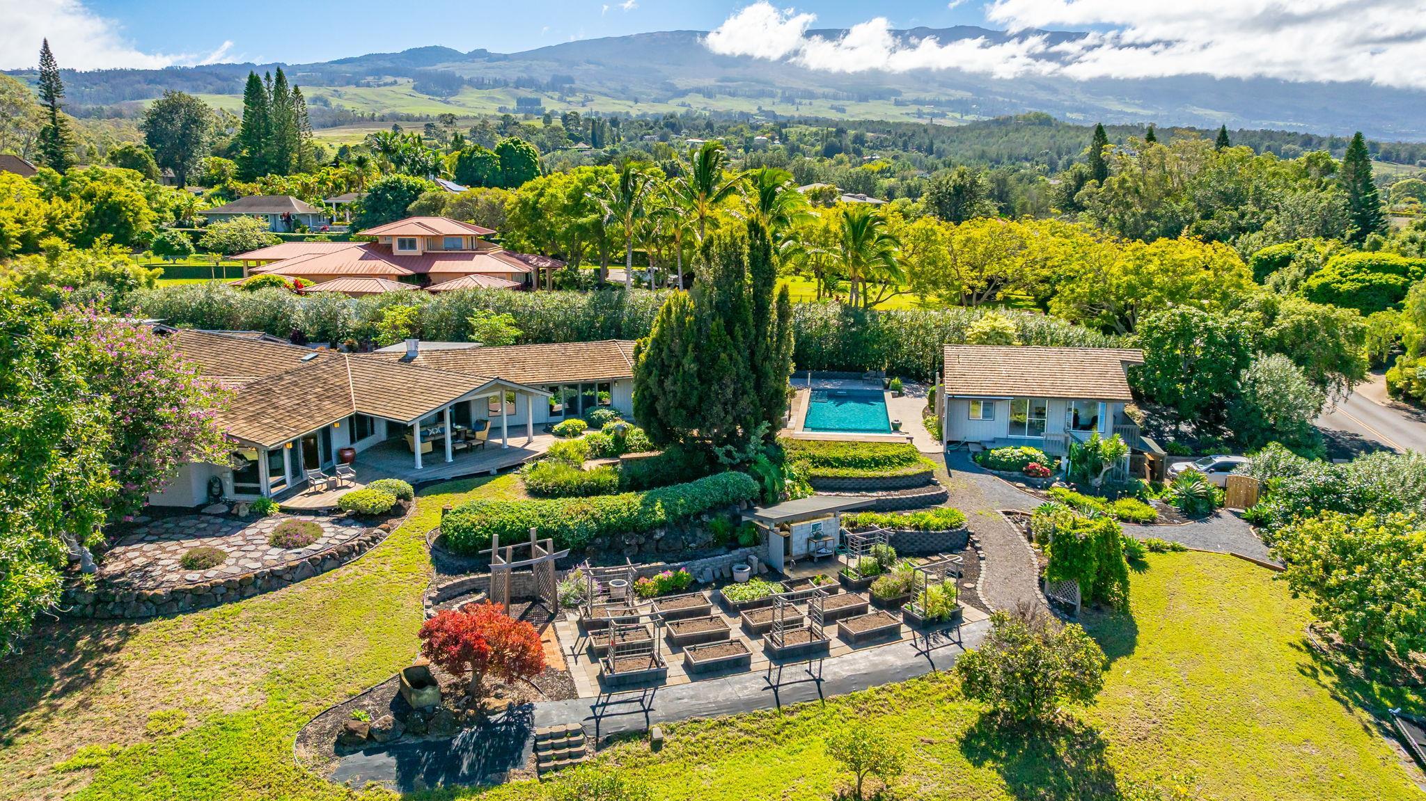 50 Poha Place Makawao, HI 96768 - Photo 7 of 50 an aerial view of a house with a garden and lake view