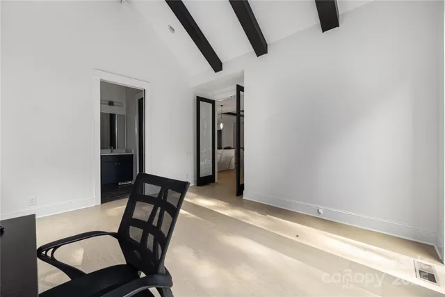 a view of a hallway with seating area