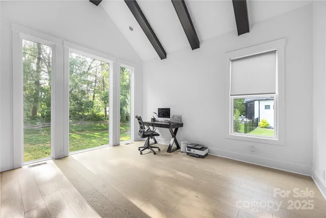 a work room with furniture and a window