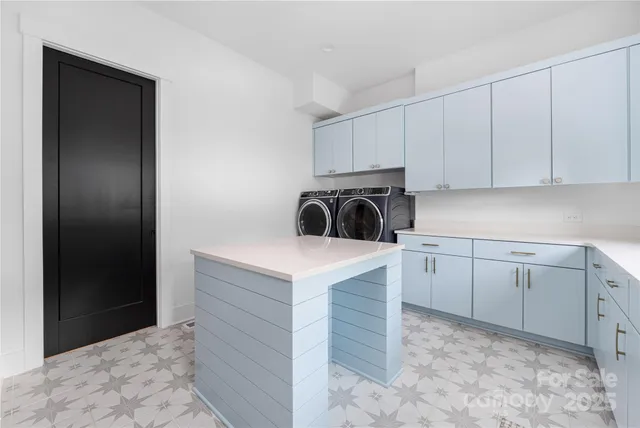 a kitchen with a cabinets and a refrigerator