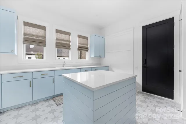 a kitchen with a sink and cabinets