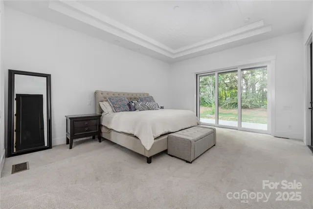 a bedroom with a bed and a couch