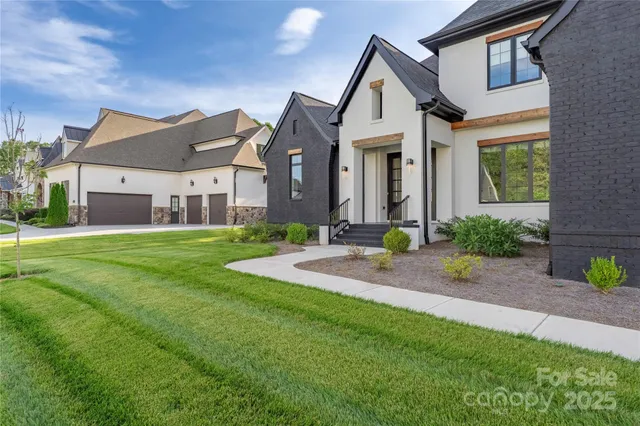 a front view of a house with garden and porch