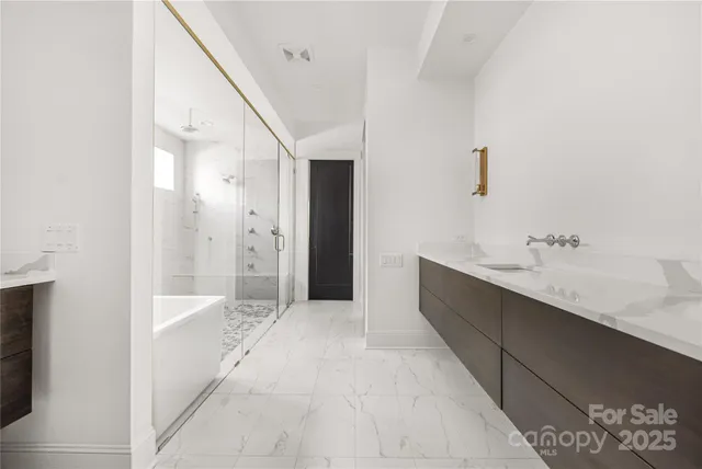 a bathroom with a bathtub and a sink