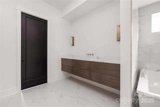 a room with a mirror and a cabinet