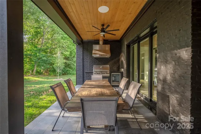 a view of a dining room with furniture and window