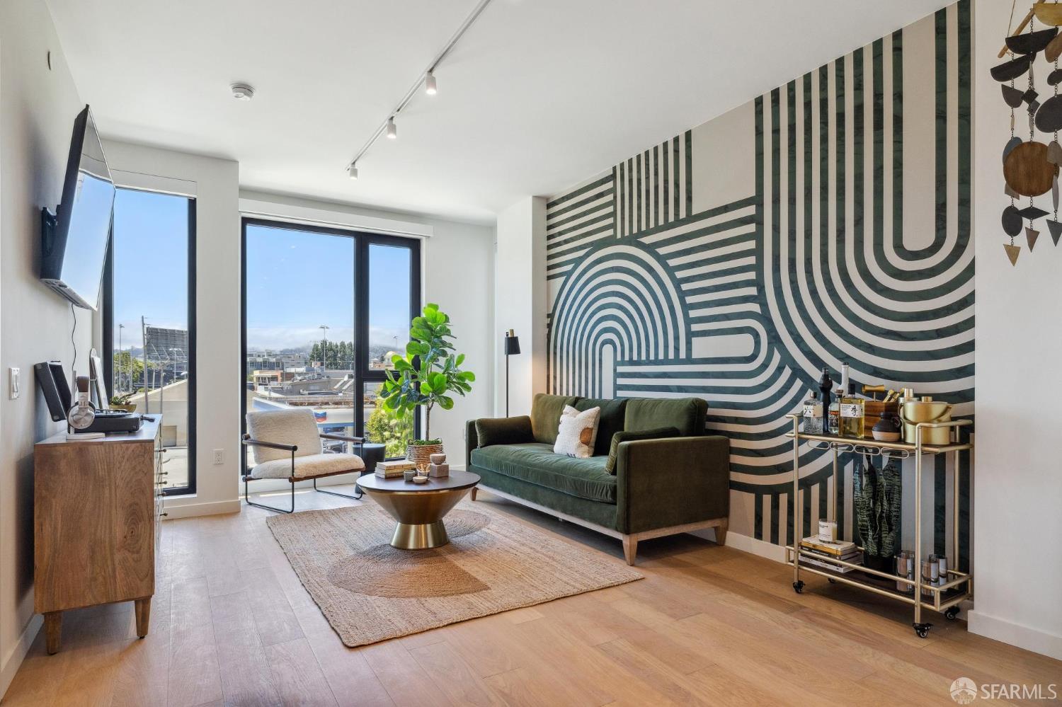 a living room with furniture and a potted plant