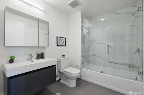 a bathroom with a sink a toilet and a bathtub