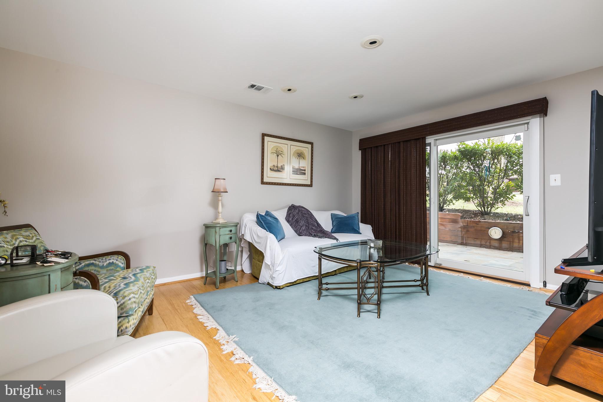 11310 Fairway Court Reston, VA 20190 - Photo 8 of 33 Living room walks out to another private patio