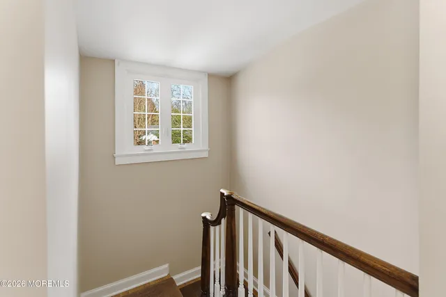 a view of a hallway with a window