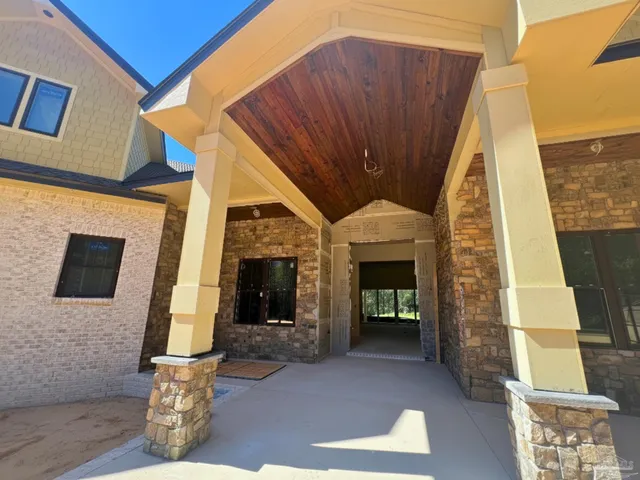 a view of living room with furniture and a fireplace
