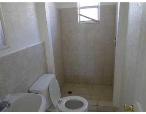 a bathroom with a toilet and a sink