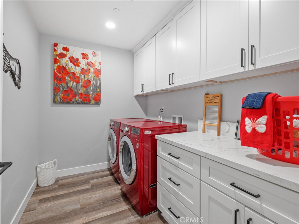 24162 Shoshone Road Apple Valley, CA 92307 - Photo 16 of 38 Large laundry room with loads of cabinets for household items