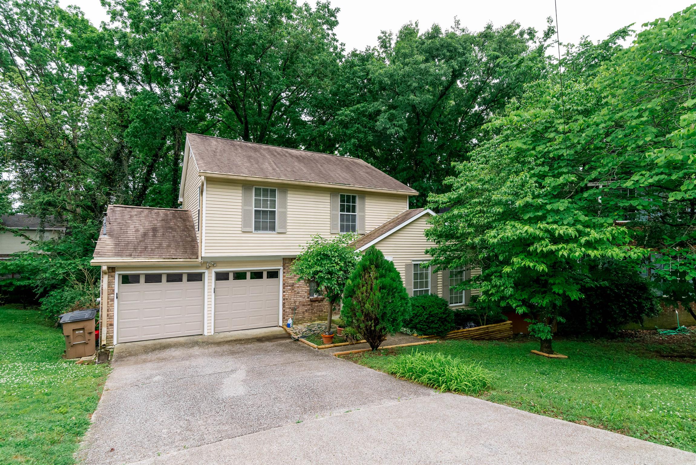 1000 Aldersgate Road Antioch, TN 37013 - Photo 1 of 30 a house with trees in the background