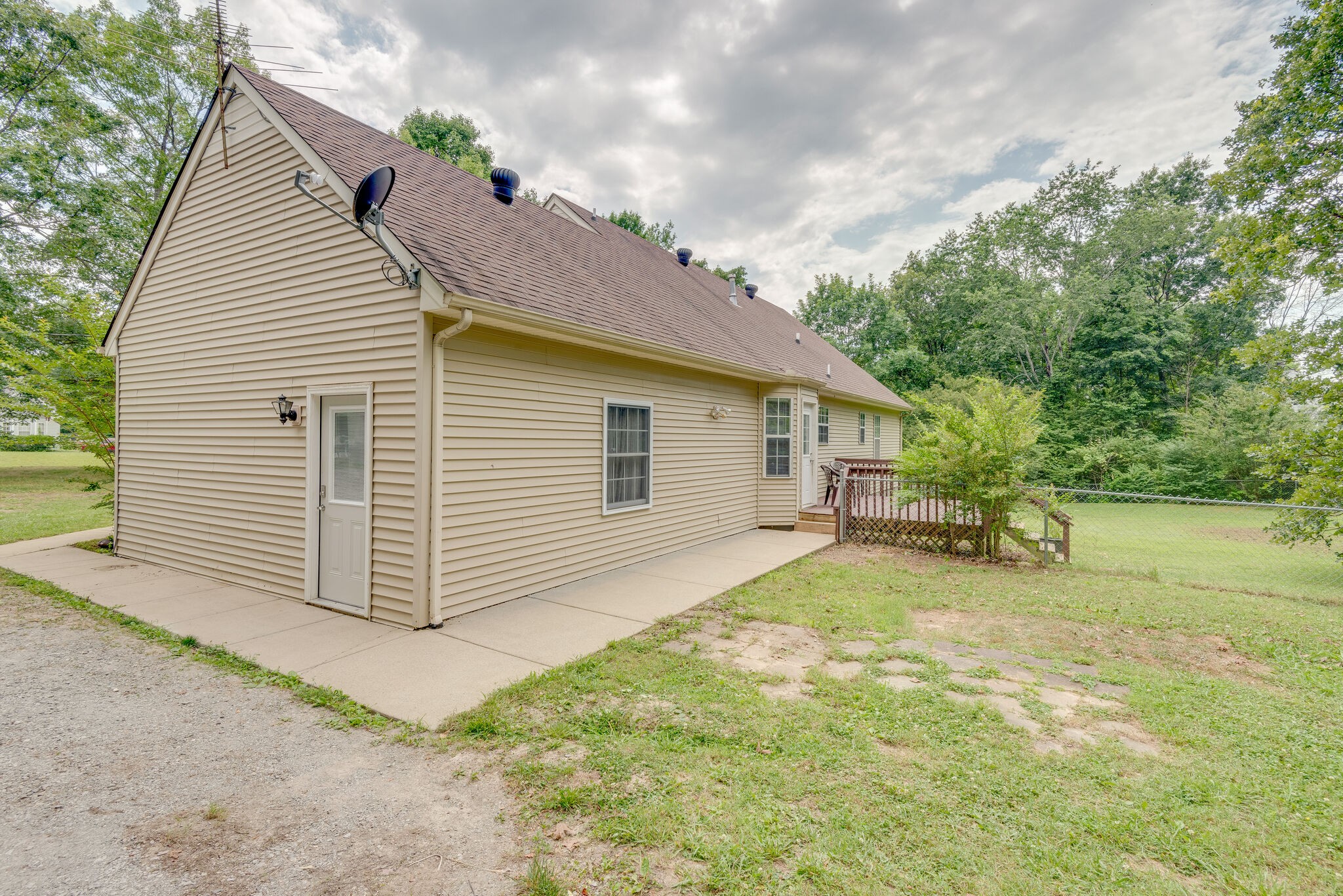 183 Gaskins Road Dickson, TN 37055 - Photo 6 of 27 a view of a house with backyard and trees