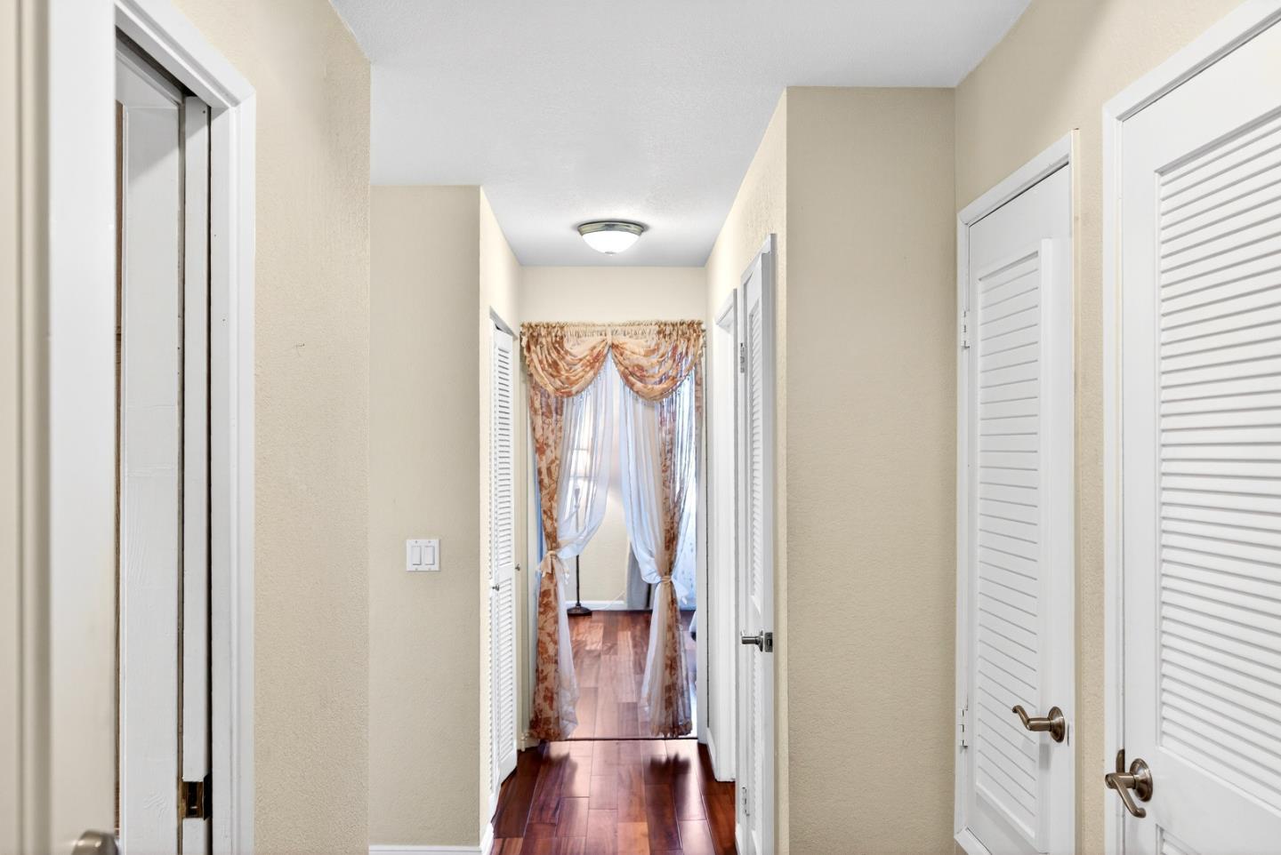 22330 Homestead Road, Unit 214 Cupertino, CA 95014 - Photo 2 of 35 a view of hallway with wooden floor