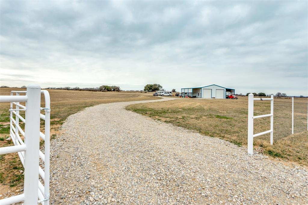 a view of a yard with an ocean view