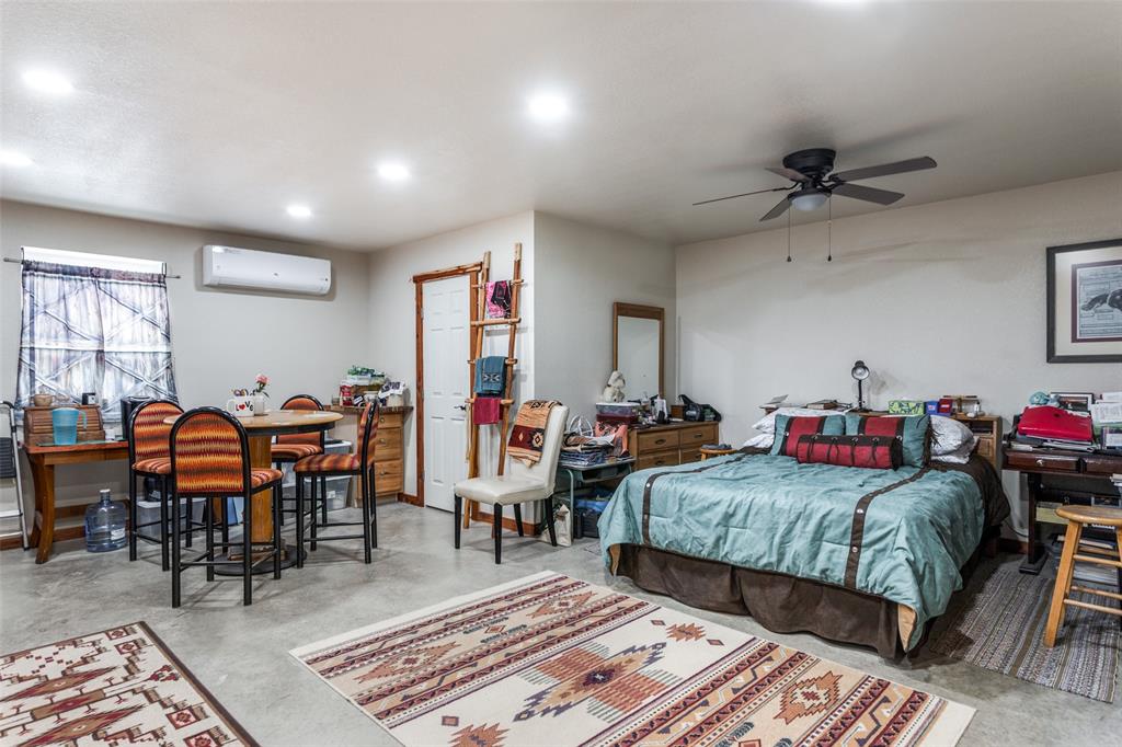218 Homestead Court Lipan, TX 76462 - Photo 7 of 17 a living room with lots of furniture and a rug