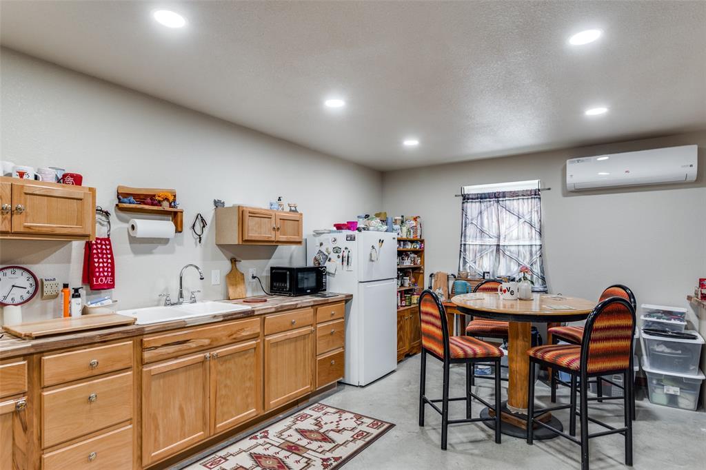 218 Homestead Court Lipan, TX 76462 - Photo 8 of 17 a kitchen that has a table and chairs in it