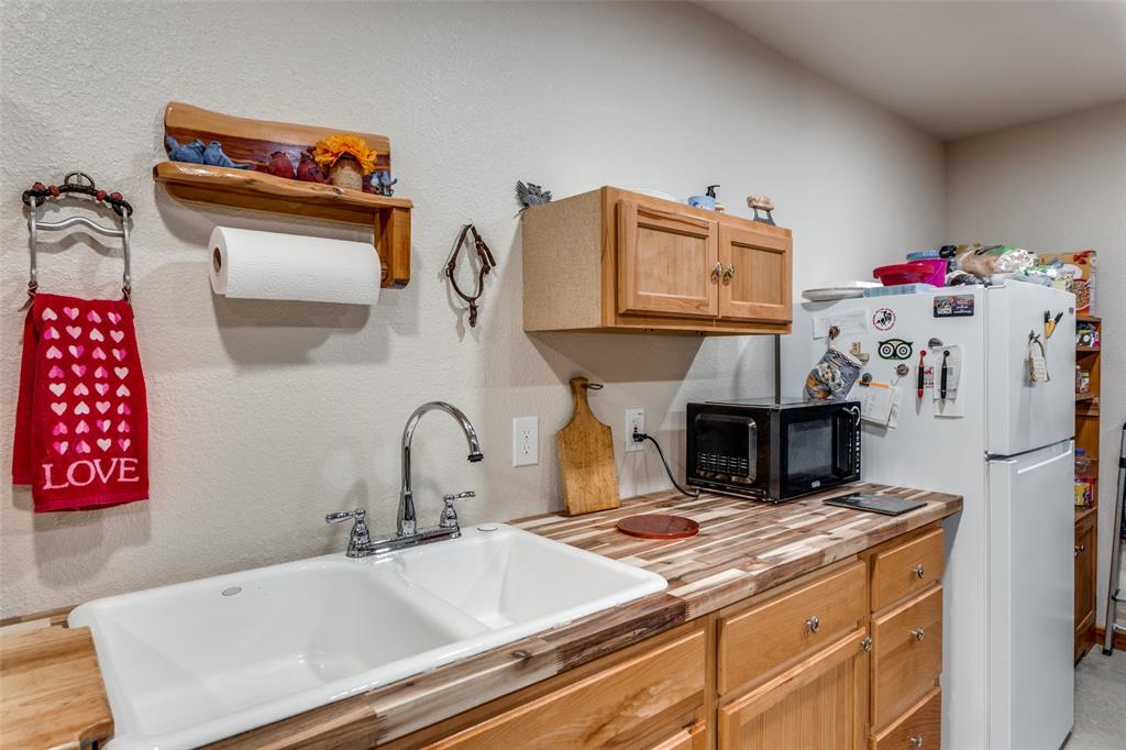 218 Homestead Court Lipan, TX 76462 - Photo 9 of 17 a bathroom with a sink and a mirror