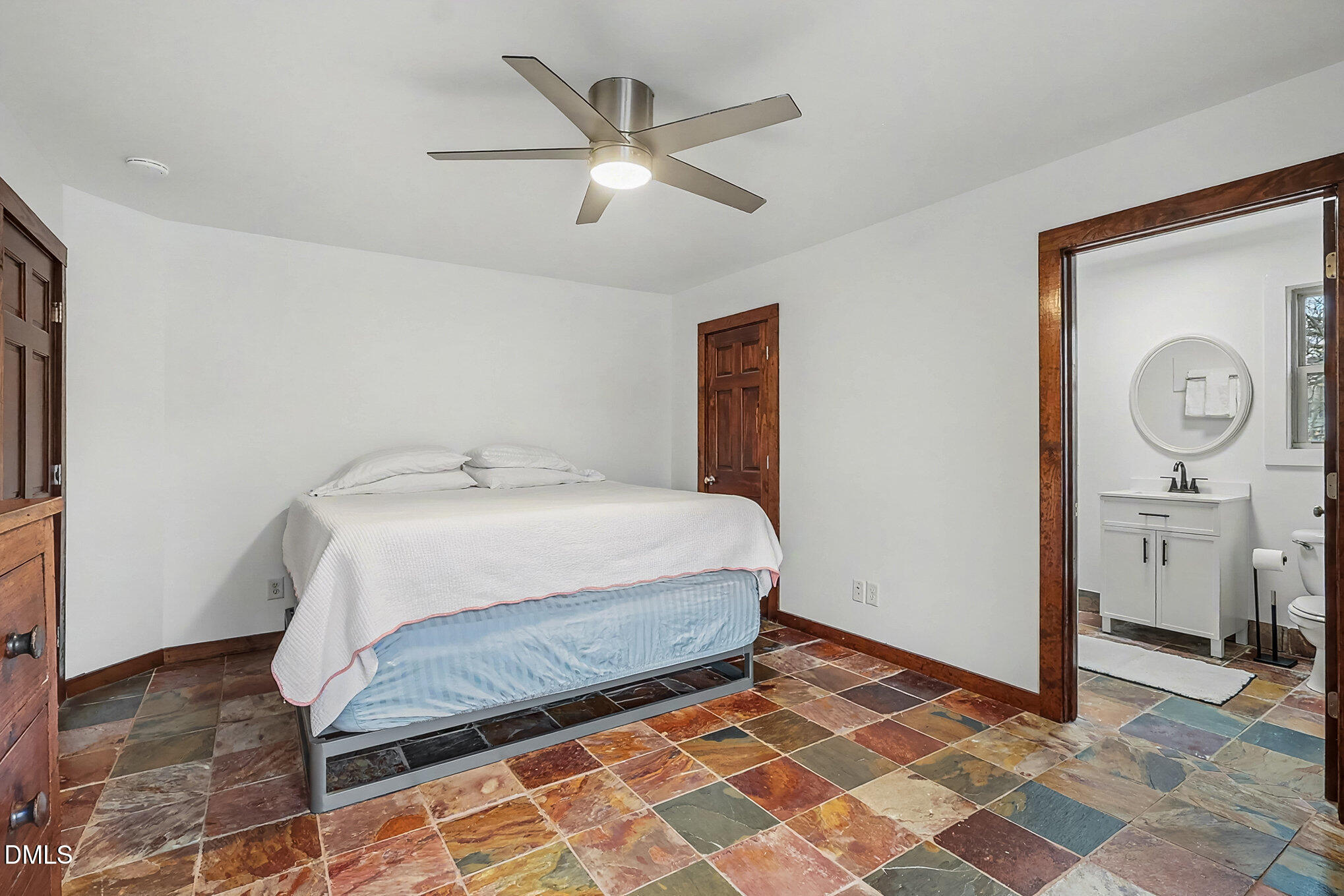 735 Cross Link Drive Angier, NC 27501 - Photo 23 of 73 a bedroom with a bed and a chandelier
