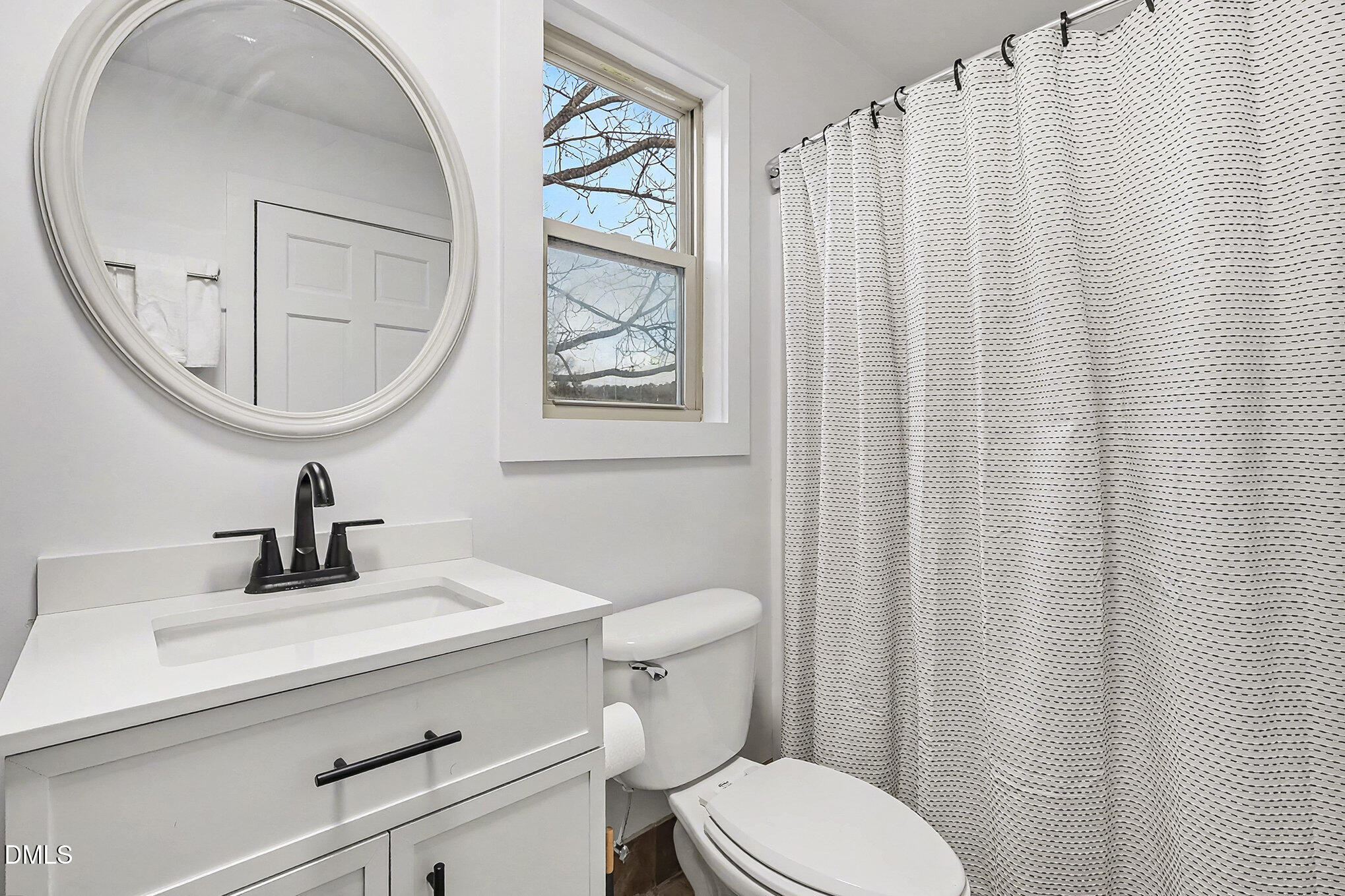 735 Cross Link Drive Angier, NC 27501 - Photo 26 of 73 a bathroom with a sink a mirror and a toilet