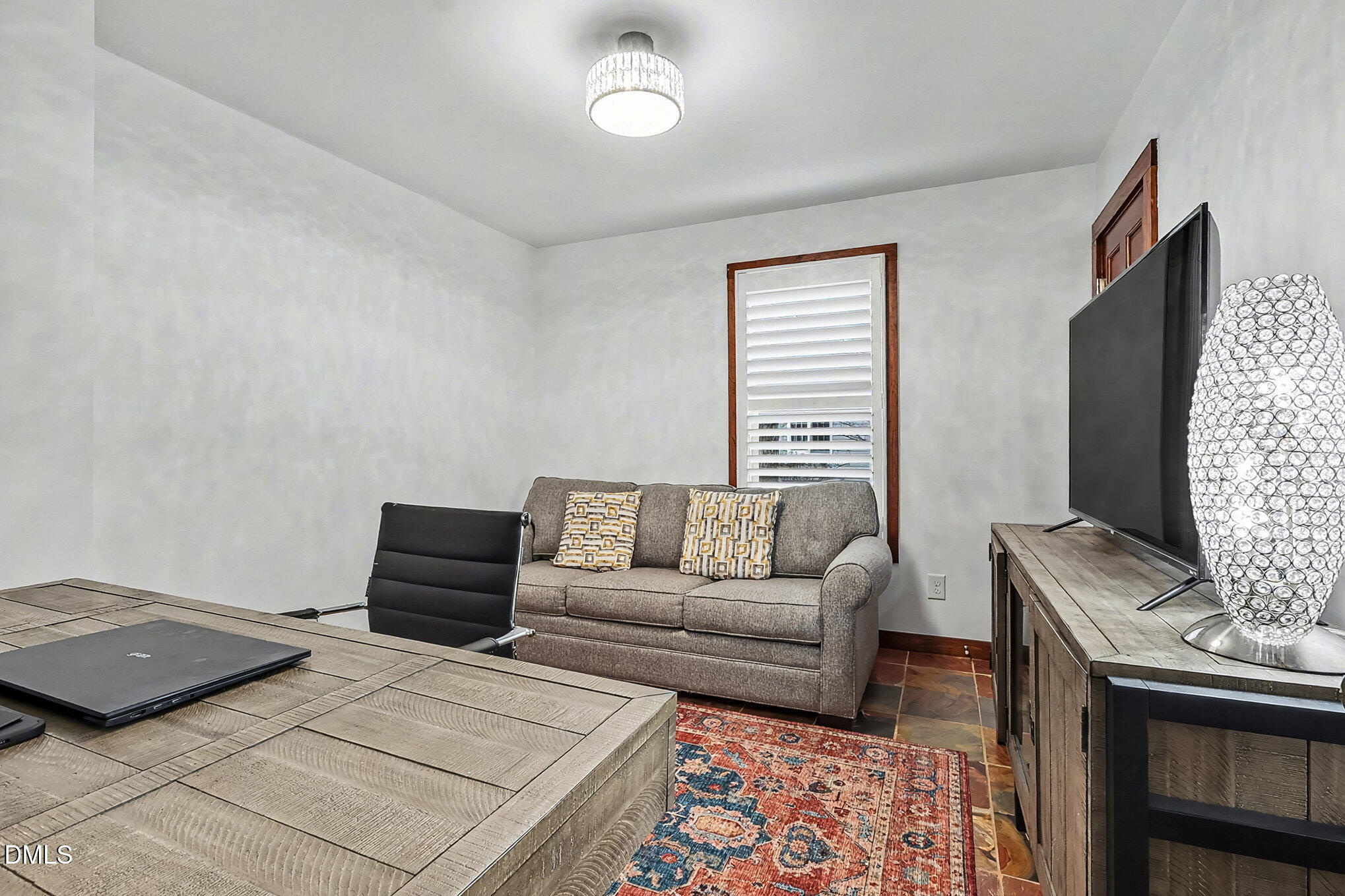 735 Cross Link Drive Angier, NC 27501 - Photo 27 of 73 a bedroom with furniture and a flat screen tv