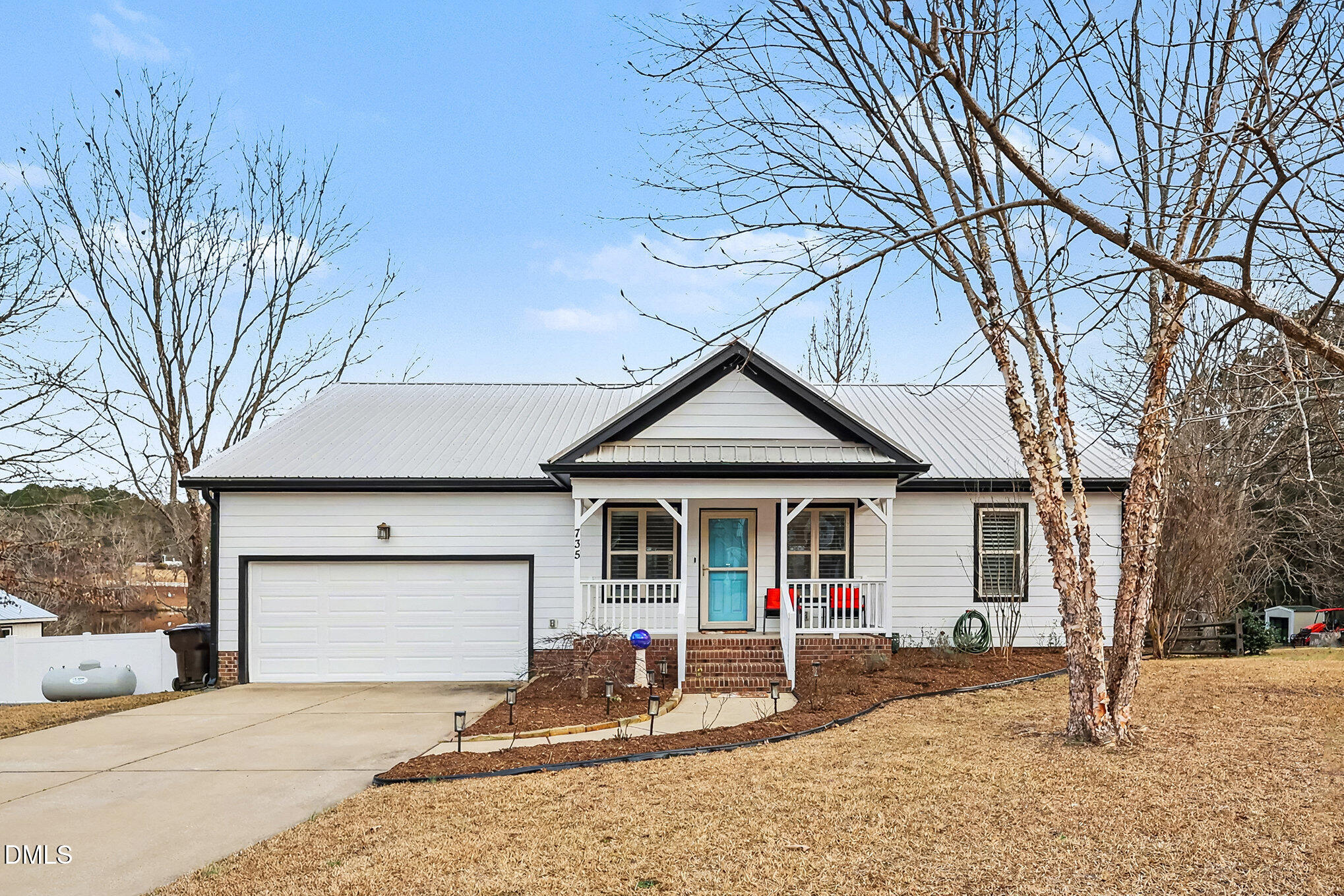 735 Cross Link Drive Angier, NC 27501 - Photo 4 of 73 a front view of a house with yard patio and fire pit