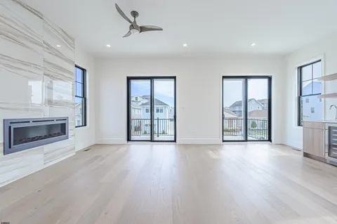 a kitchen with a wooden floor and a fireplace