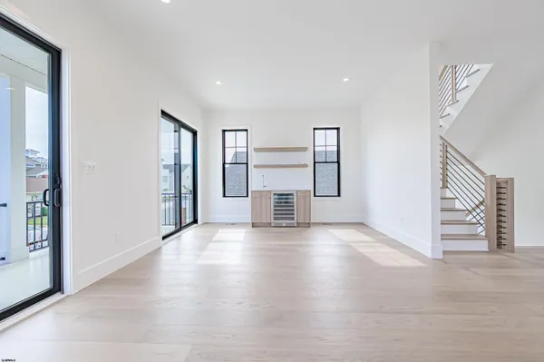 a kitchen with a refrigerator and microwave