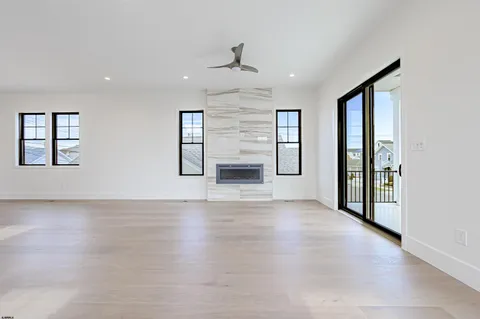 a kitchen with stainless steel appliances kitchen island granite countertop a large counter top and wooden floors