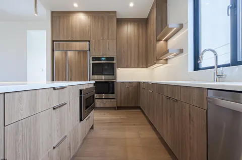 a view of a utility room with cabinets