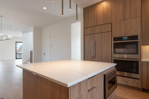 a kitchen with a refrigerator and microwave