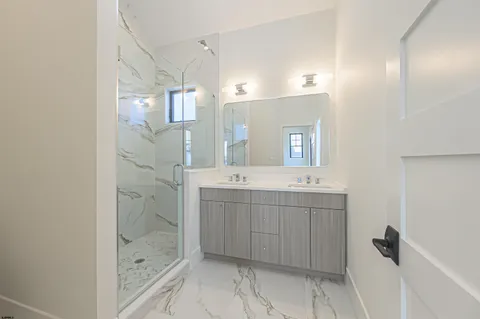 an empty room with closet and windows