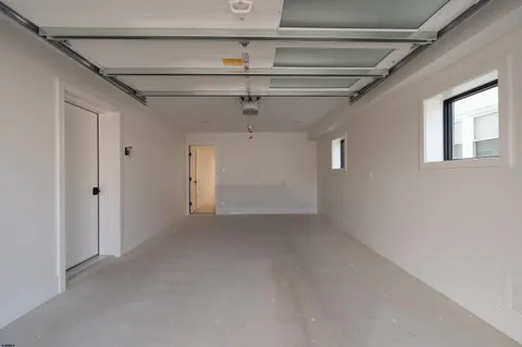 a view of a hallway with wooden floor and a hallway