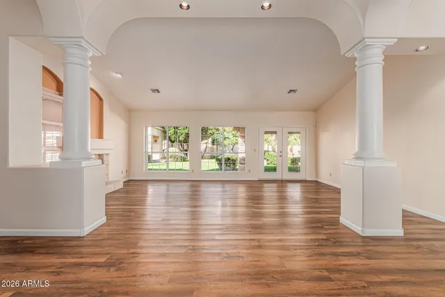 a view of a patio with table and chairs and potted plants