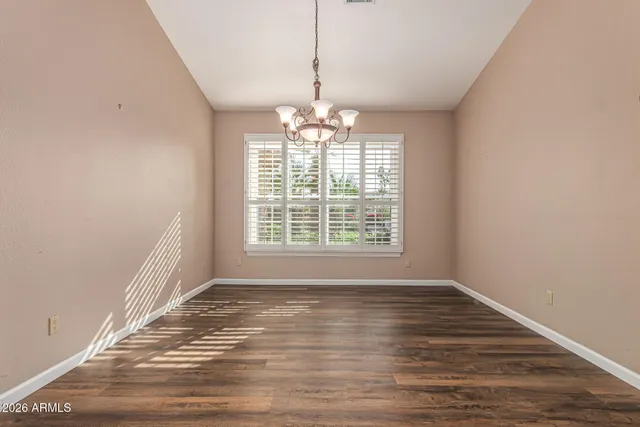 a bathroom with a granite countertop sink a toilet a mirror and shower