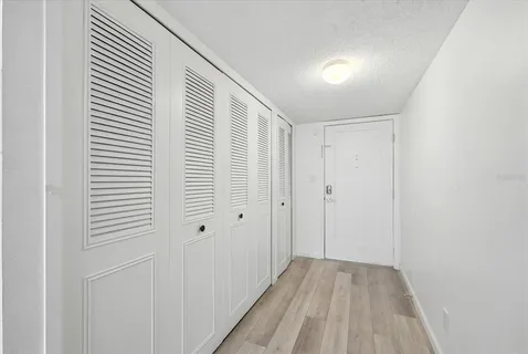 a kitchen with stainless steel appliances a stove sink microwave and cabinets