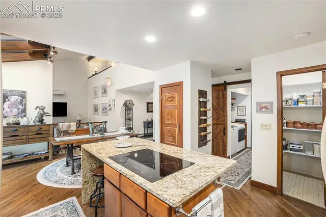 a open kitchen with stainless steel appliances granite countertop a sink stove and refrigerator