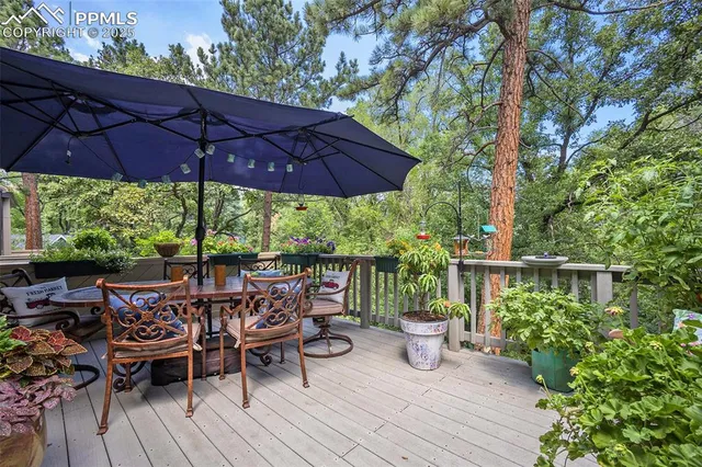 a view of balcony with outdoor seating and wooden floor
