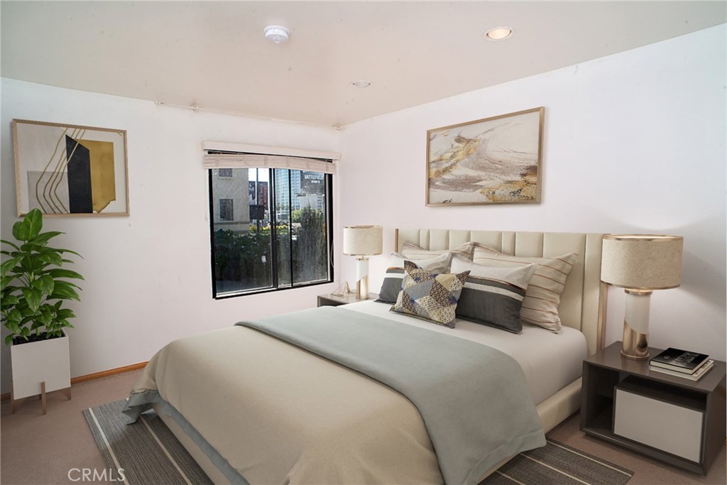 1940 Highland Avenue, Unit 10 Los Angeles, CA 90068 - Photo 12 of 22 a bedroom with bed and window