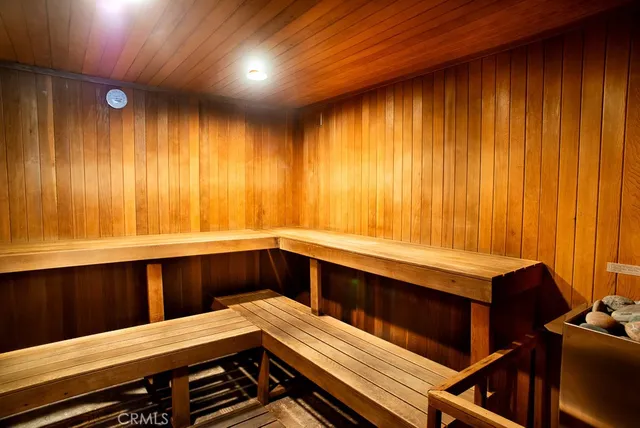 a kitchen with wooden cabinets and outdoor seating