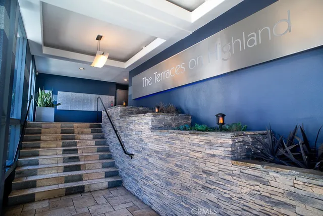 a room with wooden floor and lots of windows