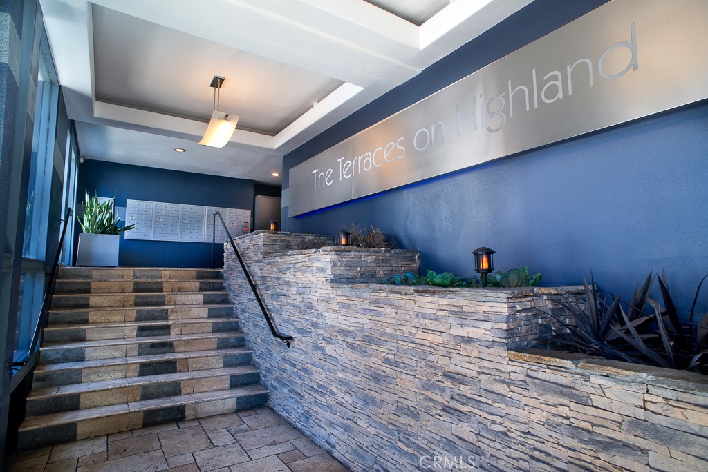 1940 Highland Avenue, Unit 10 Los Angeles, CA 90068 - Photo 21 of 22 a room with wooden floor and lots of windows