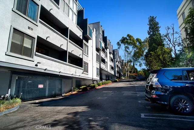 a view of a street with cars