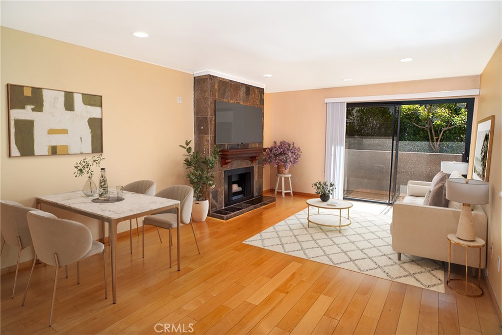 1940 Highland Avenue, Unit 10 Los Angeles, CA 90068 - Photo 5 of 22 a living room with furniture and a fireplace