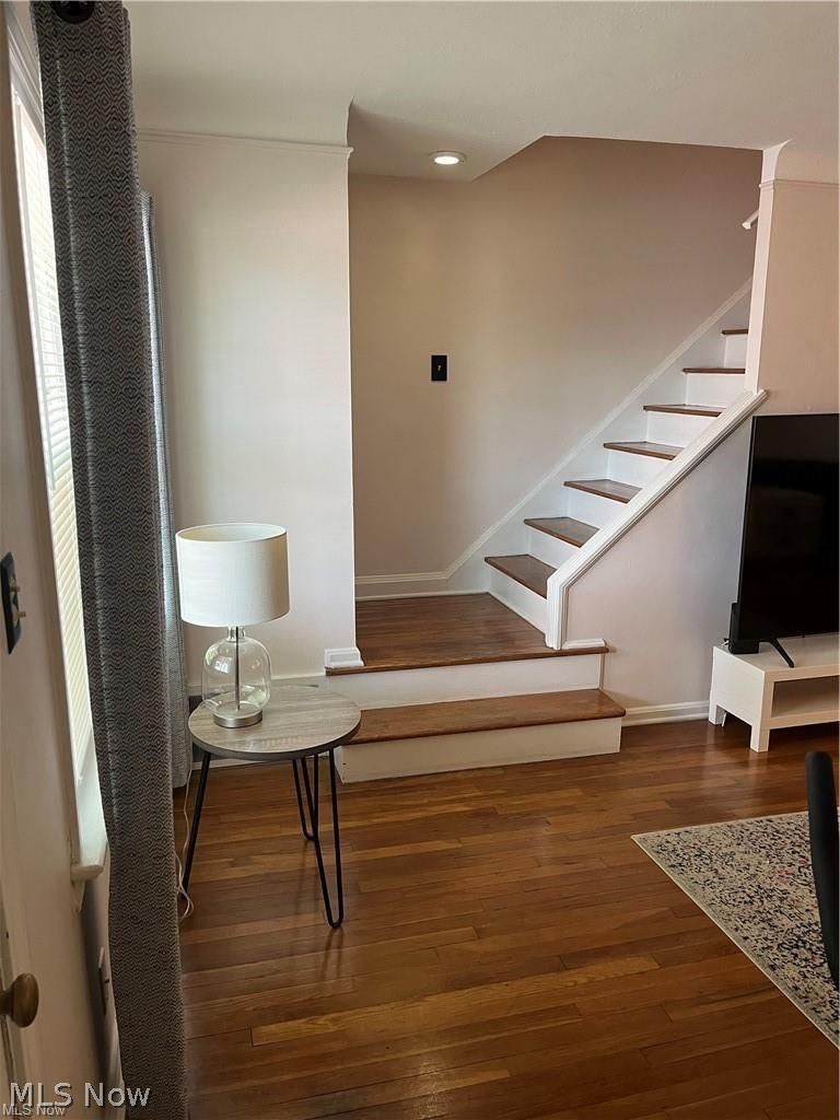 2748 Wooster Road Rocky River, OH 44116 - Photo 6 of 31 Wood-finish flooring throughout, featuring a staircase with painted risers and wood treads