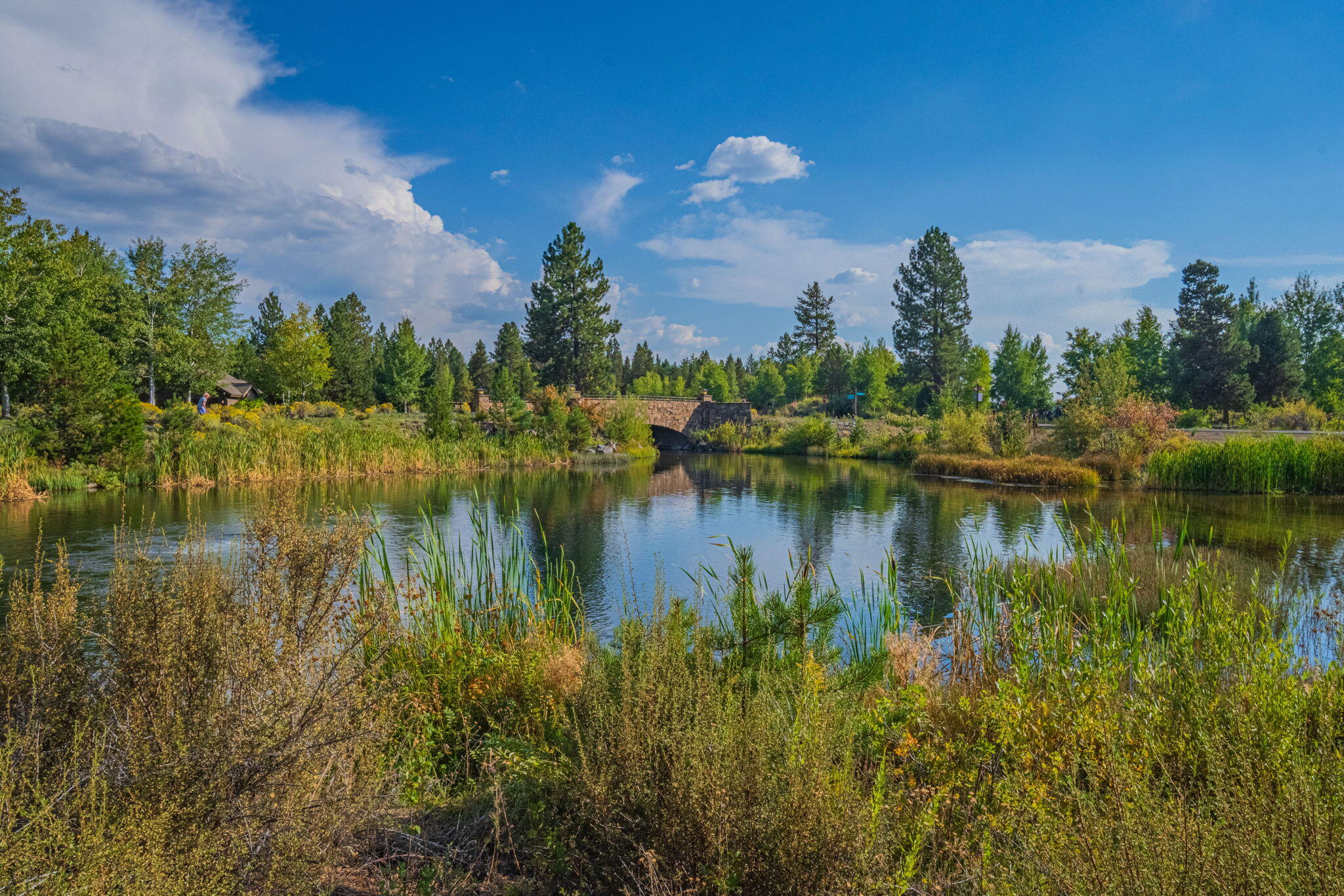 56508 Dancing Rock Loop, Unit 22 Bend, OR 97707 - Photo 4 of 69 a view of a lake with a building in front of it